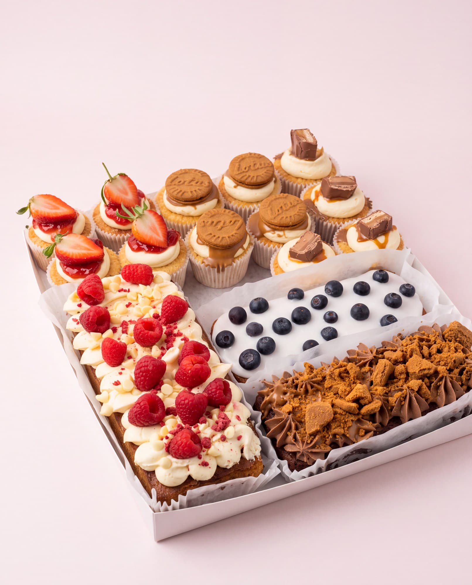 Sweet graze box of cupcakes, biscuits, brownies and fruit